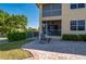 Brick patio features an outdoor seating area and offers views of lush landscaping and a screened-in porch at 3329 Purple Martin Dr # 113, Punta Gorda, FL 33950