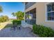 Exterior patio with waterfront view featuring an outdoor seating area and screened-in porch at 3329 Purple Martin Dr # 113, Punta Gorda, FL 33950