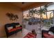 Cozy screened lanai featuring comfortable seating and tranquil water views at 3329 Purple Martin Dr # 113, Punta Gorda, FL 33950