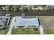 Aerial view of a house with a pool on a canal at 3339 Desoto Dr, Punta Gorda, FL 33983