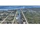 Picturesque aerial view of a waterfront community with canal access and stunning bay views in the distance at 3339 Desoto Dr, Punta Gorda, FL 33983