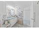 Bathroom featuring blue floral accents, vanity, and walk-in shower at 3339 Desoto Dr, Punta Gorda, FL 33983