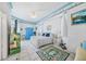 Bright bedroom featuring coastal themed decor and an inviting atmosphere with a ceiling fan at 3339 Desoto Dr, Punta Gorda, FL 33983