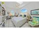 Bright bedroom with a large window and a ceiling fan, offering ample sunlight and ventilation at 3339 Desoto Dr, Punta Gorda, FL 33983