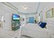 Bright bedroom featuring coastal themed decor and an inviting atmosphere with a ceiling fan at 3339 Desoto Dr, Punta Gorda, FL 33983