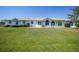 Inviting home with lush green lawn enhances its welcoming facade at 3339 Desoto Dr, Punta Gorda, FL 33983