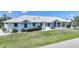 Lovely single-story home featuring a manicured lawn, neat landscaping, and a brightly painted exterior at 3339 Desoto Dr, Punta Gorda, FL 33983