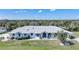 Inviting single-story home featuring lush landscaping and a well-manicured lawn at 3339 Desoto Dr, Punta Gorda, FL 33983