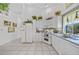 Well-lit kitchen with white cabinets, tile floors, modern appliances, and decorative accents at 3339 Desoto Dr, Punta Gorda, FL 33983