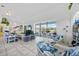 The cozy living room includes bright decor, tile floors, and a sliding glass door to the pool and lanai at 3339 Desoto Dr, Punta Gorda, FL 33983