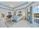 Main bedroom showcasing tray ceiling, tiled floors, and private entrance at 3339 Desoto Dr, Punta Gorda, FL 33983