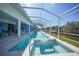 Spacious pool and hot tub with a screened enclosure overlooking the canal at 3339 Desoto Dr, Punta Gorda, FL 33983