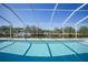 Sparkling pool with screened enclosure overlooking a tranquil canal at 3339 Desoto Dr, Punta Gorda, FL 33983