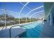 Beautiful pool with a screened enclosure and a view of the canal at 3339 Desoto Dr, Punta Gorda, FL 33983