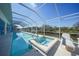 Stunning pool and hot tub with a screened lanai and canal access at 3339 Desoto Dr, Punta Gorda, FL 33983