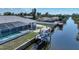 Rear exterior view of home with pool and dock on canal at 3339 Desoto Dr, Punta Gorda, FL 33983