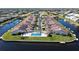 Aerial view of waterfront community with private docks, pool, and well-maintained landscaping at 3830 Bal Harbor Blvd # 6, Punta Gorda, FL 33950