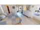 Bright bedroom with a bed, white dresser, sliding glass doors to a lanai, and closet space at 3830 Bal Harbor Blvd # 6, Punta Gorda, FL 33950