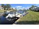 Waterfront view of a private boat dock, with ample space for a boat and beautiful scenery at 3830 Bal Harbor Blvd # 6, Punta Gorda, FL 33950