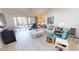 Open-concept living room with ample natural light and comfortable seating at 3830 Bal Harbor Blvd # 6, Punta Gorda, FL 33950