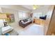 Living Room featuring a sofa, shutters, built in cabinetry and desk at 3830 Bal Harbor Blvd # 6, Punta Gorda, FL 33950
