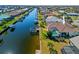 Lovely property with a backyard boat lift, screened pool, and lush landscaping, offering prime waterfront living at 400 Coronado Dr, Punta Gorda, FL 33950