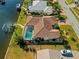 Aerial view showcasing the home's canal-front location, private pool, and lush tropical landscaping at 400 Coronado Dr, Punta Gorda, FL 33950