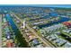 Aerial shot of waterfront community, featuring many canals, boat lifts, and well manicured lawns at 400 Coronado Dr, Punta Gorda, FL 33950