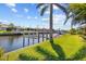 View of backyard leading to a boat lift, great for boating and enjoying waterfront living at 400 Coronado Dr, Punta Gorda, FL 33950