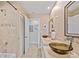 Stylish bathroom features double sinks with vessel bowls, granite counters, and modern fixtures at 400 Coronado Dr, Punta Gorda, FL 33950