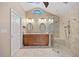 Bathroom featuring a double sink vanity and walk-in shower with glass enclosure at 400 Coronado Dr, Punta Gorda, FL 33950
