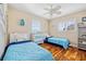 Comfortable bedroom features two beds with wood flooring and ample natural light at 400 Coronado Dr, Punta Gorda, FL 33950