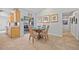 Dining area next to the kitchen features seating for four and sliding glass doors to the outside at 400 Coronado Dr, Punta Gorda, FL 33950