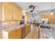 Modern kitchen featuring granite countertops, stainless steel appliances, and an open layout to the living room at 400 Coronado Dr, Punta Gorda, FL 33950