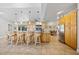 Spacious kitchen with natural wood cabinetry, granite countertops, stainless steel appliances, and tile flooring at 400 Coronado Dr, Punta Gorda, FL 33950