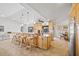 Bright kitchen features a large island with seating, granite counters, tile floors, and ample storage space at 400 Coronado Dr, Punta Gorda, FL 33950