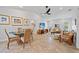 Bright living room with a dining table, comfortable seating, and tile floors at 400 Coronado Dr, Punta Gorda, FL 33950