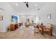 Bright living room features comfortable seating, tile floors, and a ceiling fan at 400 Coronado Dr, Punta Gorda, FL 33950