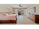 Spacious main bedroom features light wood floors, and a ceiling fan at 400 Coronado Dr, Punta Gorda, FL 33950
