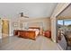 Spacious main bedroom features light wood floors, and a ceiling fan at 400 Coronado Dr, Punta Gorda, FL 33950