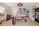 Bright office features a unique glass desk, neutral paint, and decor at 400 Coronado Dr, Punta Gorda, FL 33950