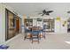 Expansive patio features a dining set with views of the waterfront and bright skies at 400 Coronado Dr, Punta Gorda, FL 33950
