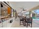 Spacious covered patio features an outdoor dining area with views of the pool and canal at 400 Coronado Dr, Punta Gorda, FL 33950