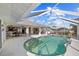 Beautiful pool area with screened enclosure offering clear views of the sky and neighborhood at 400 Coronado Dr, Punta Gorda, FL 33950