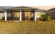 Spacious screened patio with seating area, perfect for outdoor relaxation at 43104 Lakeside Way, Punta Gorda, FL 33982