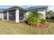Screened patio with lush landscaping and a relaxing atmosphere at 43104 Lakeside Way, Punta Gorda, FL 33982