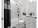 Clean bathroom with white cabinets, bathtub shower combo, and stylish decor at 43104 Lakeside Way, Punta Gorda, FL 33982