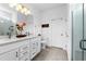 Double vanity bathroom with modern finishes and a large shower at 43104 Lakeside Way, Punta Gorda, FL 33982
