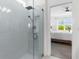 Modern bathroom with a glass shower and bedroom view at 43104 Lakeside Way, Punta Gorda, FL 33982
