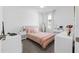 Bedroom with a bed, dresser, and a full-length mirror at 43104 Lakeside Way, Punta Gorda, FL 33982